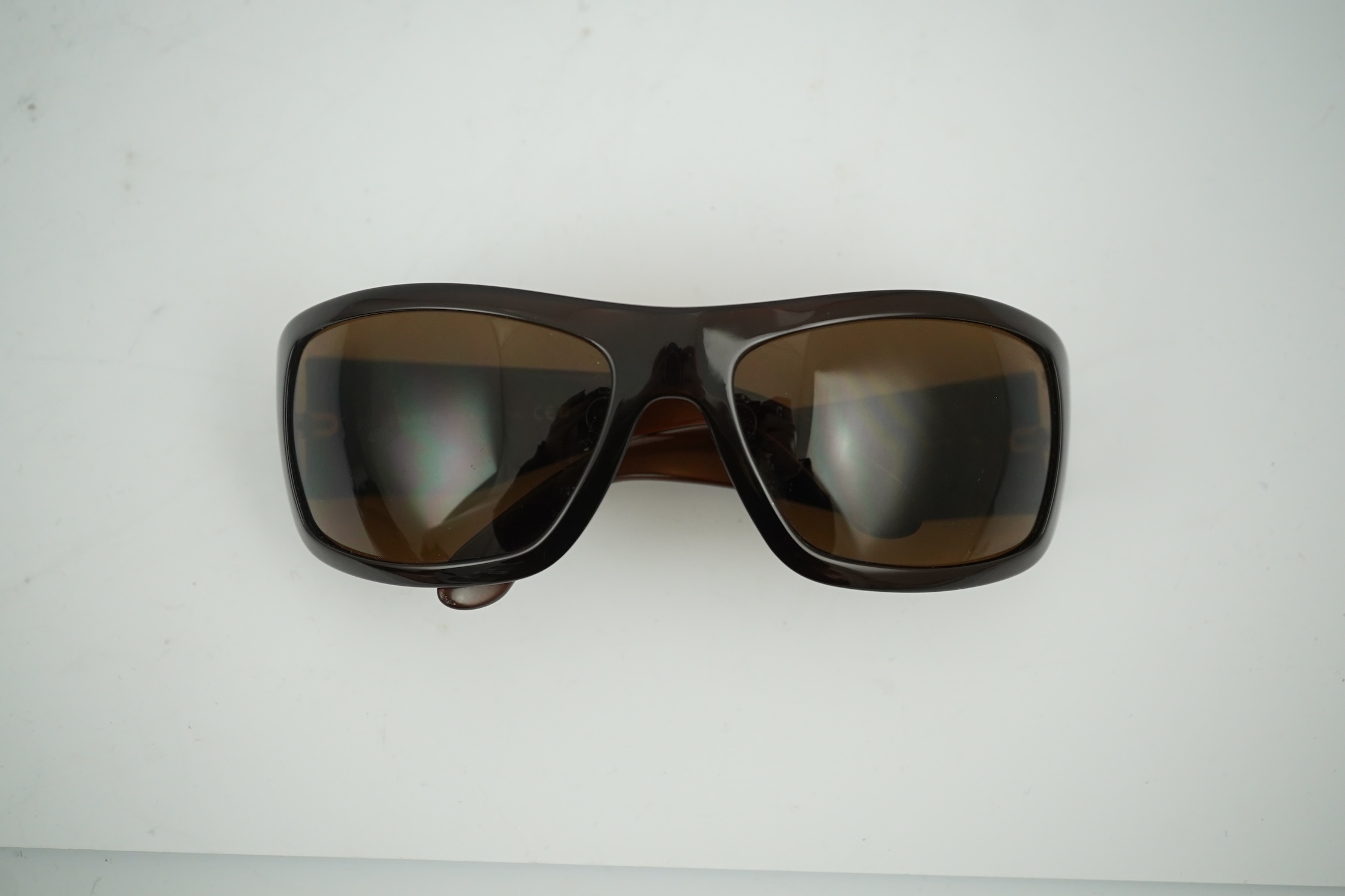 A pair of lady's brown Chanel sunglasses with hard case